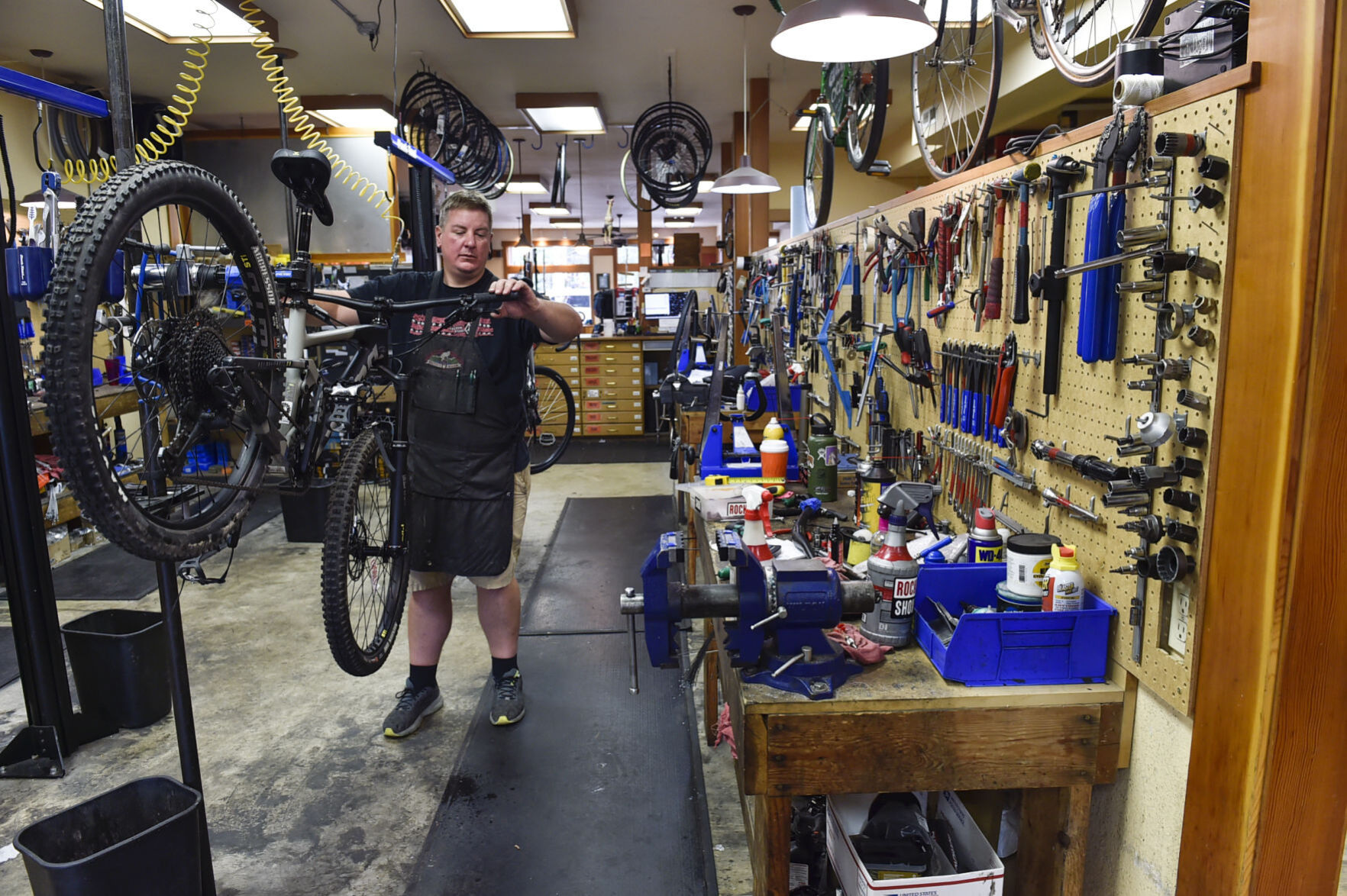 John Morris services a customer's bike